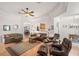 Inviting living room with hardwood floors, comfortable furniture, and ample natural light at 8708 Laurel N Dr, Pinellas Park, FL 33782