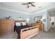 Inviting bedroom featuring soft carpeting, comfortable bed, and natural wood furniture at 8708 Laurel N Dr, Pinellas Park, FL 33782