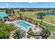 Aerial view showcasing the community pool surrounded by lush landscaping, perfect for relaxation at 8708 Laurel N Dr, Pinellas Park, FL 33782