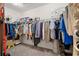 Walk-in closet with ample storage, shelving, and organizational system at 8708 Laurel N Dr, Pinellas Park, FL 33782