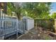 Backyard with a small shed for outdoor storage and a wood fence at 909 E 28Th Ave, Tampa, FL 33605
