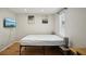 Bedroom featuring wood floors, TV, neutral walls, bright windows, and tasteful decor at 909 E 28Th Ave, Tampa, FL 33605