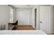 Bedroom featuring a closet, desk, and natural light, creating a functional and inviting space at 909 E 28Th Ave, Tampa, FL 33605