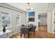 Charming dining room with wood floors and stylish chandelier, perfect for entertaining at 909 E 28Th Ave, Tampa, FL 33605