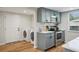 Well-organized kitchen adjacent to laundry area; stainless steel appliances and sleek countertops at 909 E 28Th Ave, Tampa, FL 33605