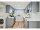 Efficient kitchen design with stainless appliances, stylish cabinets, and updated finishes at 909 E 28Th Ave, Tampa, FL 33605