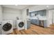 View of the laundry area with updated washer and dryer, located adjacent to the kitchen at 909 E 28Th Ave, Tampa, FL 33605