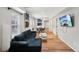Inviting living room with hardwood flooring, modern lighting and an open floorplan at 909 E 28Th Ave, Tampa, FL 33605