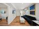 Inviting living room features a sectional sofa, wood flooring, and stylish decor at 909 E 28Th Ave, Tampa, FL 33605