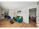 Open living room with hardwood flooring, colorful modern furniture and recessed lighting at 909 E 28Th Ave, Tampa, FL 33605