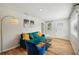 Cozy living room featuring sleek hardwood floors, bright decor and fresh paint at 909 E 28Th Ave, Tampa, FL 33605
