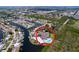 Aerial view of the waterfront home featuring a pool and peninsula location at 9631 Oak Ne St, St Petersburg, FL 33702