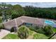 Aerial shot showcasing a pool and spacious backyard with access to the waterway at 9631 Oak Ne St, St Petersburg, FL 33702