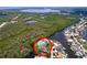 Aerial view of the waterfront home featuring a pool and peninsula location at 9631 Oak Ne St, St Petersburg, FL 33702