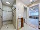 View of a bathroom with walk-in shower needing renovation with exposed walls, tile flooring, and open doorway at 9631 Oak Ne St, St Petersburg, FL 33702