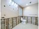 View of a bathroom needing renovation showing a toilet, window, tile flooring, and exposed walls at 9631 Oak Ne St, St Petersburg, FL 33702
