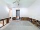 View of a bedroom needing renovation features exposed walls and an open closet and entry way at 9631 Oak Ne St, St Petersburg, FL 33702