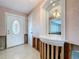 Entryway showcasing interior with tile flooring, view to living area, and wallpaper at 9631 Oak Ne St, St Petersburg, FL 33702