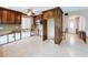 Kitchen featuring wood cabinets, microwave, and access to front door at 9631 Oak Ne St, St Petersburg, FL 33702