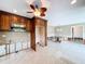 Kitchen featuring wood cabinets, microwave, and open access to dining room at 9631 Oak Ne St, St Petersburg, FL 33702