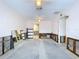 View of a spacious living room needing renovation with exposed walls, ceiling fans, and open doorways at 9631 Oak Ne St, St Petersburg, FL 33702