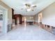 Open living room with tile flooring, bright lighting, and view to front door at 9631 Oak Ne St, St Petersburg, FL 33702