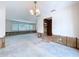 Living room with connecting spaces and natural light, ready for your custom design at 9631 Oak Ne St, St Petersburg, FL 33702