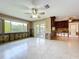 Living room featuring tile floors, large window, and sliding glass door to lanai at 9631 Oak Ne St, St Petersburg, FL 33702