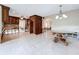 Spacious living room with tile floors, kitchen access, and chandelier lighting at 9631 Oak Ne St, St Petersburg, FL 33702