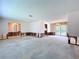 Bright living area featuring sliding glass doors to the patio and ample natural light at 9631 Oak Ne St, St Petersburg, FL 33702