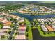 Great aerial view of a community with lake access, offering beautiful homes in a picturesque setting at 16227 Cape Coral Dr, Wimauma, FL 33598