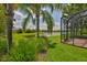 Backyard with pond and palm trees at 16227 Cape Coral Dr, Wimauma, FL 33598