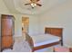Bright bedroom featuring a trey ceiling, neutral color scheme, and ample space for relaxation and personalization at 16227 Cape Coral Dr, Wimauma, FL 33598