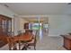 Charming dining room with a wood table and chairs, perfect for Gathering gatherings and entertaining guests at 16227 Cape Coral Dr, Wimauma, FL 33598