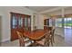 Elegant dining area showcasing a classic wood table, chairs, and a beautiful hutch, ideal for formal dining at 16227 Cape Coral Dr, Wimauma, FL 33598