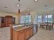 Bright open kitchen with a large island, stainless steel appliances and eat in breakfast nook at 16227 Cape Coral Dr, Wimauma, FL 33598