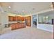 Open-concept kitchen with stainless steel appliances and stylish cabinetry at 16227 Cape Coral Dr, Wimauma, FL 33598