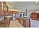 Spacious kitchen featuring stainless steel appliances, a center island, and open floorplan at 16227 Cape Coral Dr, Wimauma, FL 33598