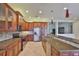 Gourmet kitchen with granite countertops, stainless steel appliances, and ample storage space at 16227 Cape Coral Dr, Wimauma, FL 33598