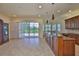 Open-concept kitchen with a central island, perfect for entertaining and Gathering gatherings at 16227 Cape Coral Dr, Wimauma, FL 33598