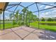 Screened lanai with brick flooring, perfect for enjoying outdoor living at 16227 Cape Coral Dr, Wimauma, FL 33598