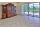 Open floorplan living space with backyard view and access to the outdoor living at 16227 Cape Coral Dr, Wimauma, FL 33598
