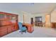 Spacious office boasts custom wood built-ins, desk, and a comfortable chair, perfect for a productive work environment at 16227 Cape Coral Dr, Wimauma, FL 33598