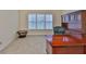 Well-lit office featuring a window, desk, and custom wood built-in, offering a comfortable and organized workspace at 16227 Cape Coral Dr, Wimauma, FL 33598