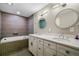 Bathroom featuring a double vanity, soaking tub, and modern fixtures at 1 Beach Se Dr # 1902, St Petersburg, FL 33701