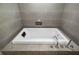 A close up of a modern, oversized white bathtub with chrome faucet and temperature controls at 1 Beach Se Dr # 1902, St Petersburg, FL 33701