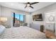 Bedroom with television, seating area, and bathroom at 1 Beach Se Dr # 1902, St Petersburg, FL 33701