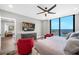 Bedroom with water view, ceiling fan, and TV at 1 Beach Se Dr # 1902, St Petersburg, FL 33701