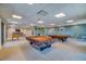 Spacious game room features billiards tables, foosball, a lounge area, and city views at 1 Beach Se Dr # 1902, St Petersburg, FL 33701