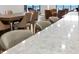 Kitchen island and countertop with seating, open to dining and ocean views at 1 Beach Se Dr # 1902, St Petersburg, FL 33701